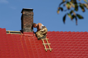 Roofing contractor working on repair project