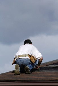 roofer working on a roof replacement project